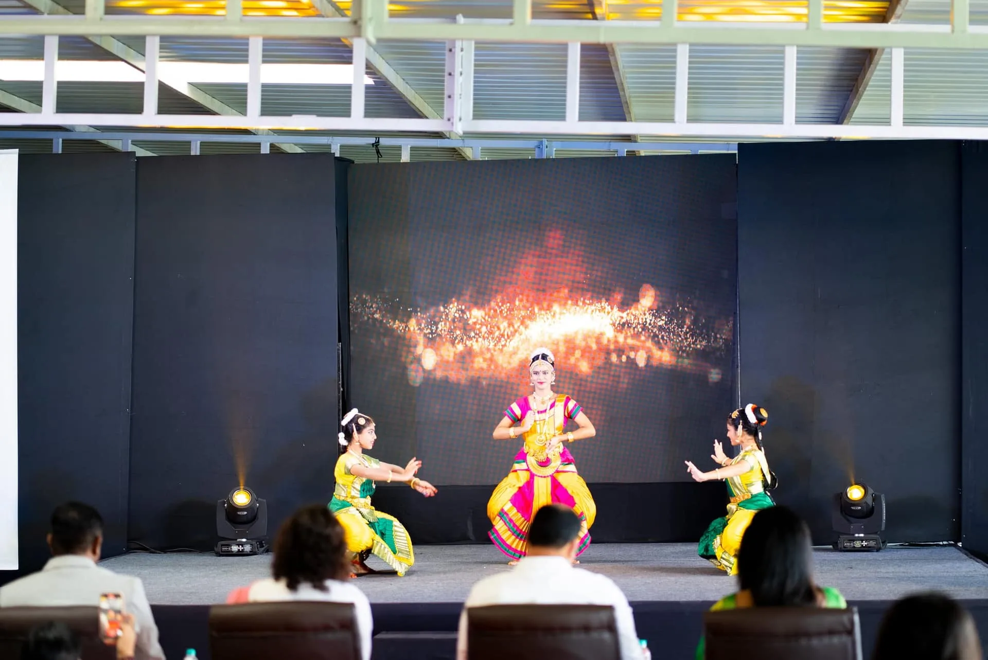 GoldenBee students performing a classical dance on stage at the annual concert