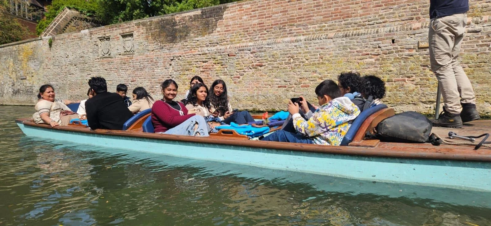 GoldenBee students punting along a historic river during the UK immersion programme