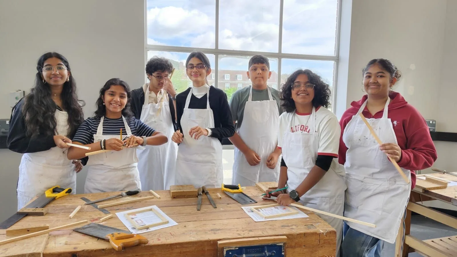 GoldenBee students at a hands-on woodwork workshop during the UK immersion programme